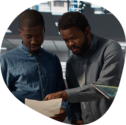 Two colleagues reviewing documents together