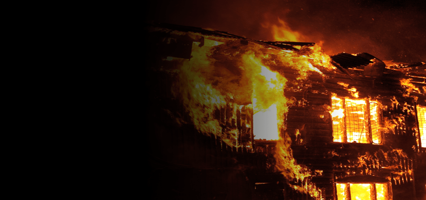 Building engulfed in fire at night