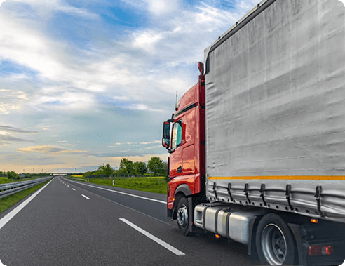 Truck carrying cargo driving along an open highway