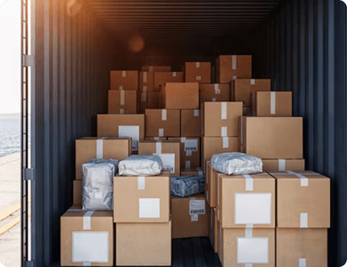 Stacked boxes and wrapped cargo inside a shipping container