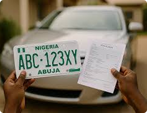 Hands holding a Nigerian license plate and registration document in front of a car
