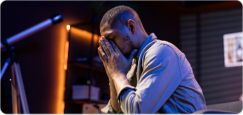 Man looking stressed while on the phone