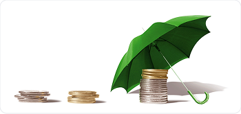 Stacked coins beside a small umbrella